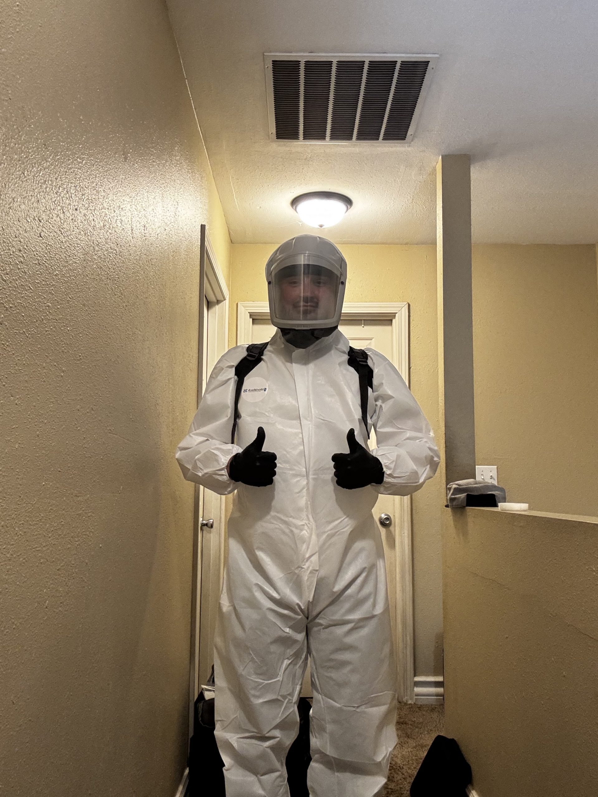 Technician in protective equipment
